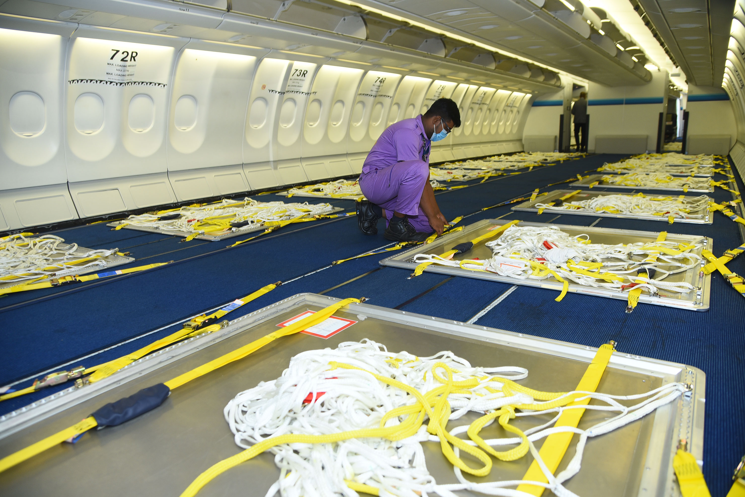 A SriLankan Airlines Engineering Technician fixing cargo pallets